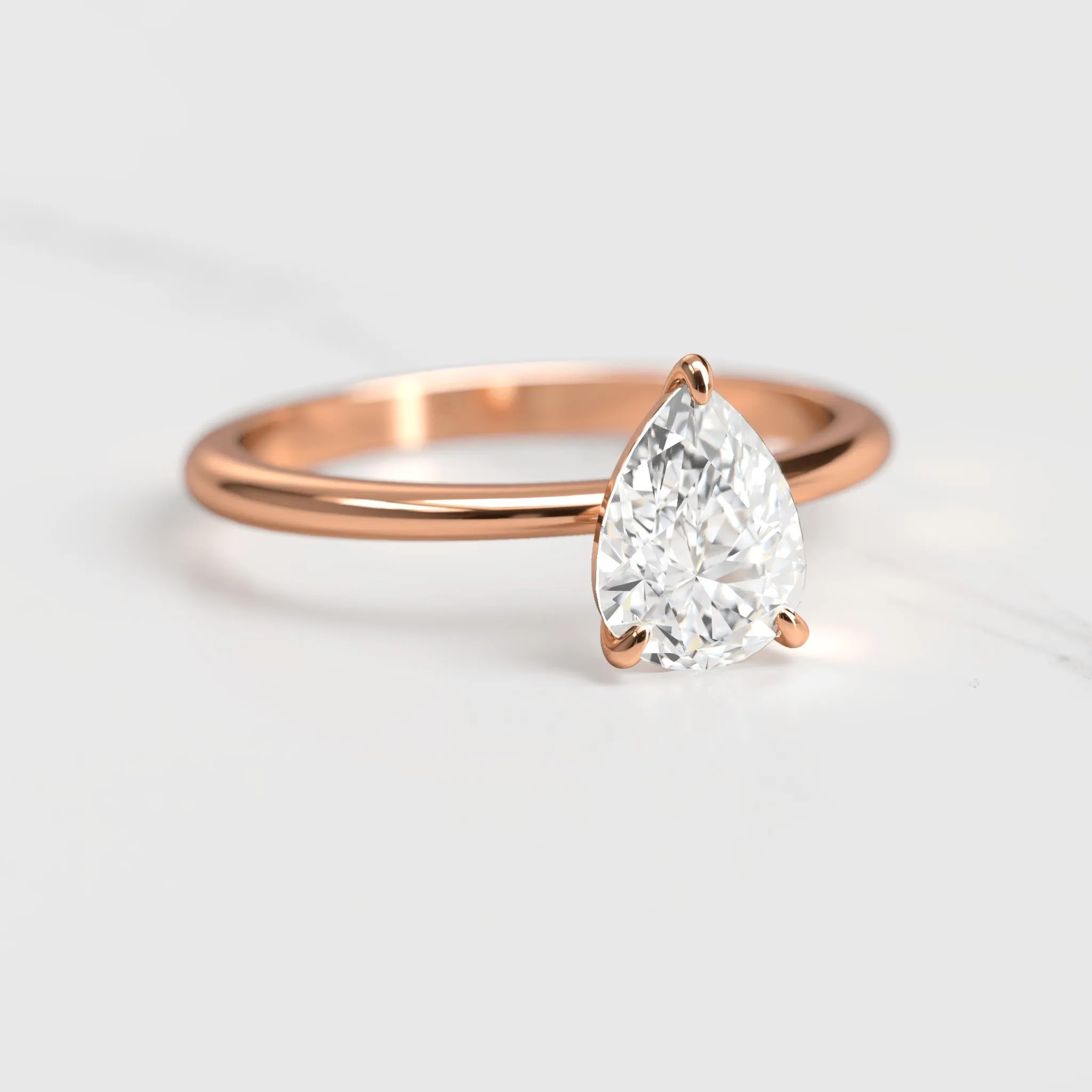 Pear Tapered Solitaire Diamond Ring